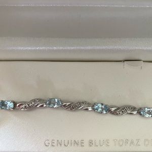 Genuine blue topaz diamond accent bracelet.